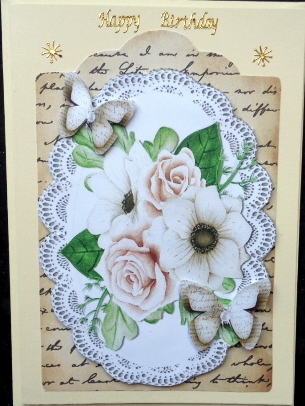 Cream roses and paper butterflies on script topper & lace by Mary Murphy
