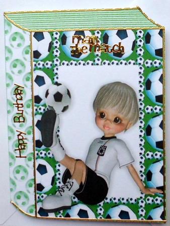Boy Sitting Down Playing Footie in Green Folded Book by Mary Murphy