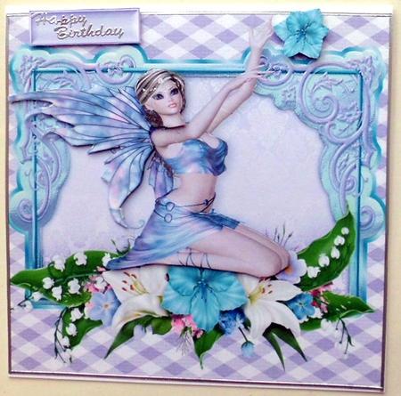 Pretty Fairie Sitting Down with Flowers by Mary Murphy