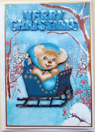 Cute Puppy in a Sleigh in the Snow by Mary Murphy