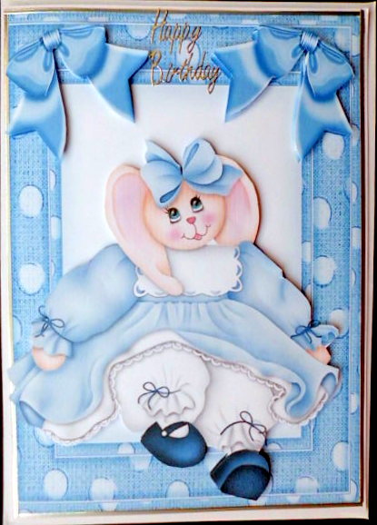 Bunny Girl in Blue Spot Frame with Bows by Mary Murphy
