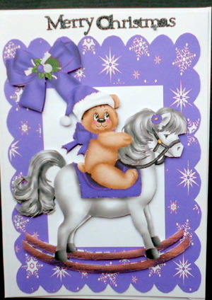 Teddy with Santa Hat on Purple Rocking Horse by Mary Murphy