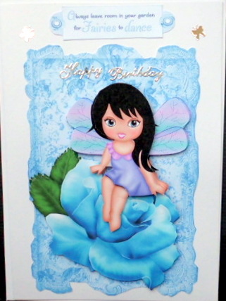 Sweet Faerie Sitting on Blue Rose on Lace by Mary Murphy