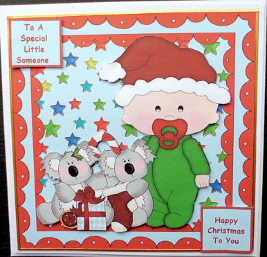 Christmas Baby with Toy Koalas by Mary Murphy
