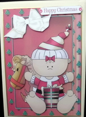 Baby Dressed Up as Santa with Toys by Mary Murphy