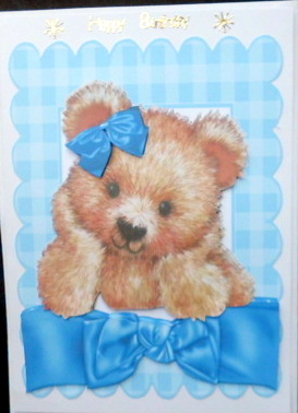 Cuddly Brown Bear with Blue Bow by Mary Murphy