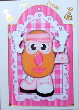 Mrs Potato Head with Handbag, on a Tag with Rosette by Mary Murphy