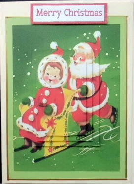 Santa and Mrs Claus Playing in the Snow Square Pyramids by Mary Murphy