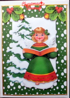 Christmas Tree in Snow with Carol Singing Angel by Mary Murphy