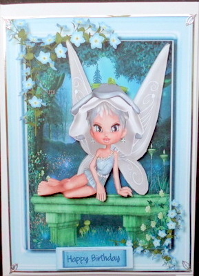 Beautiful Bluebell Fairy Sitting on a Bench by Mary Murphy