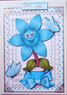 Happy Little Turq Flower with Butterflies and Bow by Mary Murphy