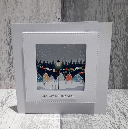 Whimsical Christmas lights garland & snowy village by Mary Thomsen