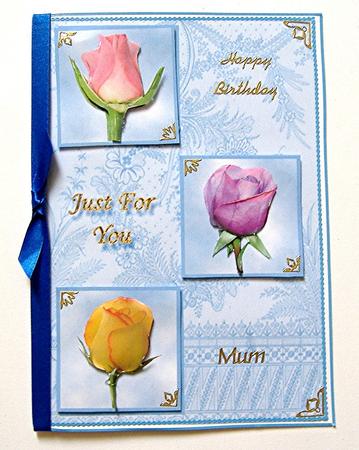 3 Rose Buds for You on Blue by Maxine Jones