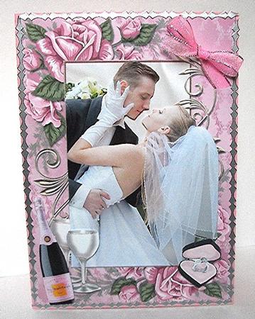 Wedding Couple in Rose Frame with Champers by Maxine Jones