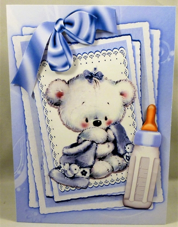 Cute little white bear with blue bow and  bottle on stacker and lace  by Michelle Chivers
