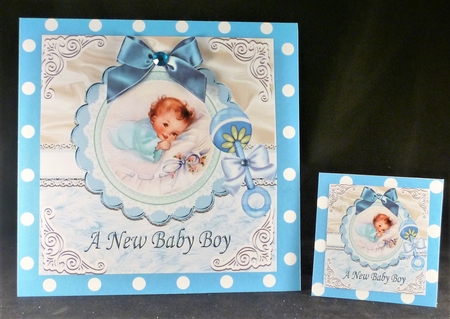 Sweet baby boy with blue bow & rattle on lace/fur 8x8 by Michelle Chivers