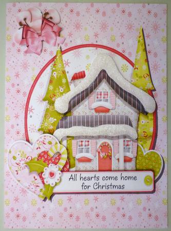 Pretty Christmas House in Oval Frame by Michelle Chivers