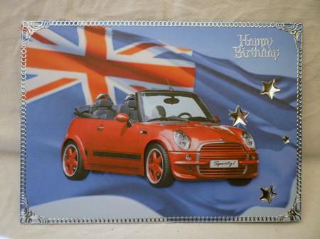 Sporty Mini Cooper on Australian Flag by Michelle Chivers