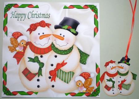 Mr & Mrs Snowman with Cute Little Bird in Santa Hat by Michelle Chivers