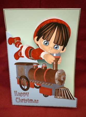 Little Christmas Elf & Train A5 Shaped Front Card in Blue by Michelle Chivers