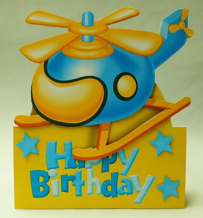 Yellow & Blue Toy Helicopter Over the Edge by Michelle Chivers