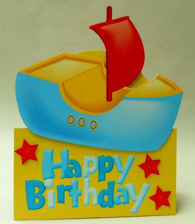 Blue & Yellow Toy Boat Over the Edge by Michelle Chivers