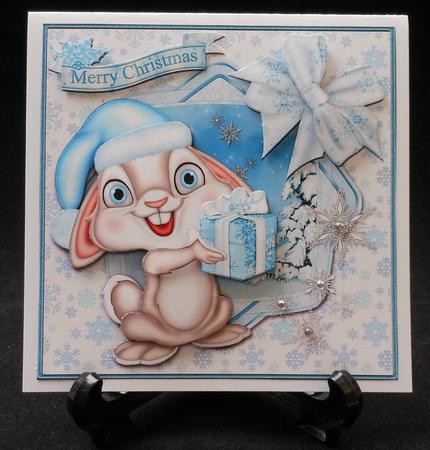 Christmas Bunny in Blue Square Card Front by Michelle Chivers