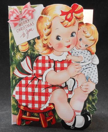 Cute Little Girl Cuddling Her Doll at Christmas by Michelle Chivers