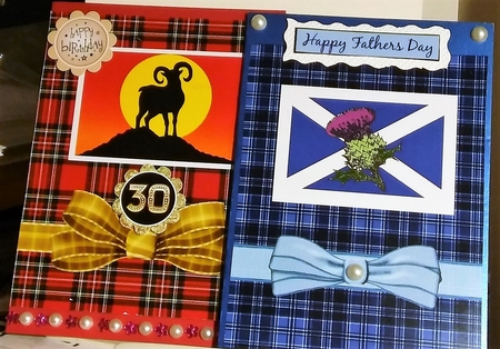 Two Tartans Blue and One Red. Each with an Image On. by Moira Paterson  (Ornella)
