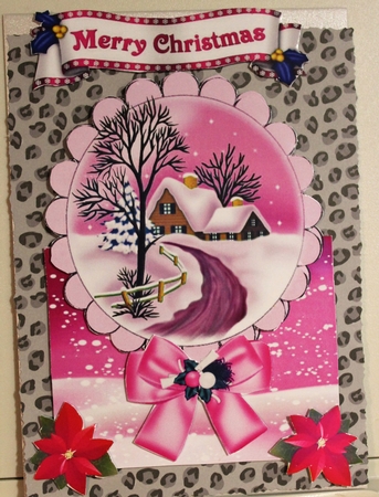 Lovely snow scene with cottage, and pink bow over the edge by Moira Paterson  (Ornella)