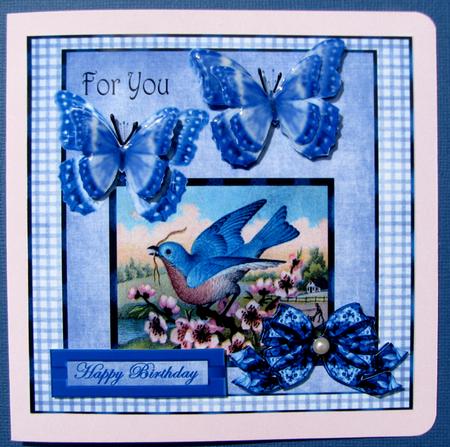 Beautiful Bleu Bird with Butterflies by Nancy Boatwright