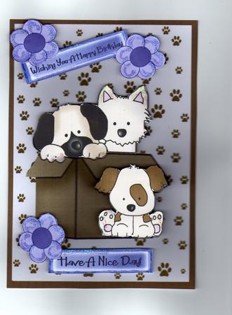Cute Little Puppies in a Box with Flowers by Kay Bowley