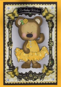 Cute Bear in Yellow on Effective Lace Background by Kay Bowley