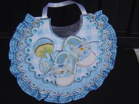 Baby Boys Bib with Blue Bootees and Rattle by MARION CORBETT