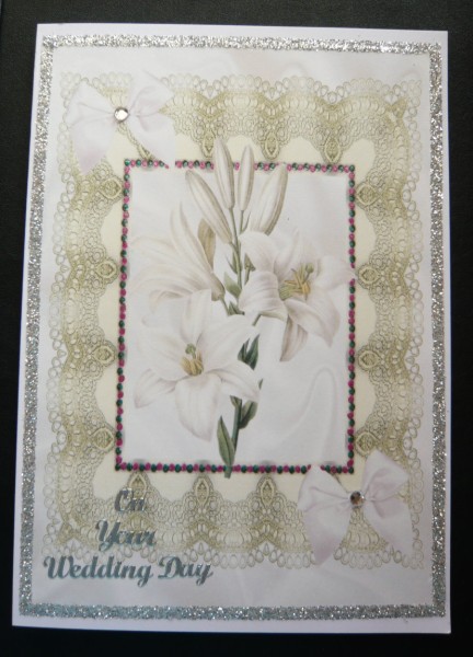 Lillies on Vintage Lace with Cream Bow A4 by Norma Howgate
