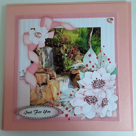 Beautiful Waterfall and pink flowers  by Pam Ogilvy