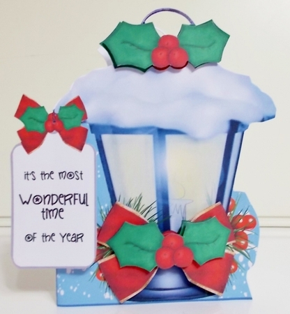 Blue lantern with holly  by Pam Stubley