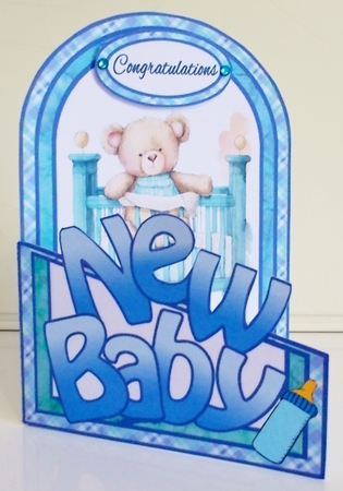 Cutaway Bear in a cot (Boy) by Pam Stubley