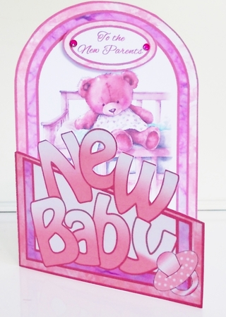 Cutaway Bear in a cot (Girl) by Pam Stubley