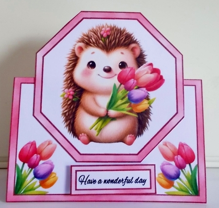 Cute baby hedgehog with tulips by Pam Stubley