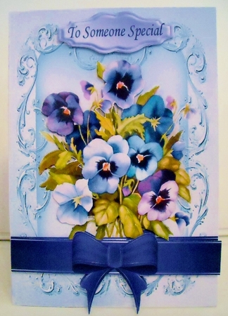 pretty blue shades of pansies with bow in scroll frame by Pam Stubley