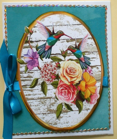 two pretty bird and floral toppers with bows by Pamela Horton