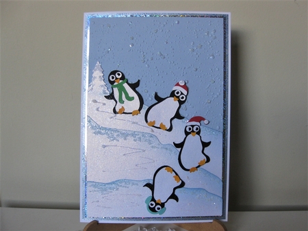 Tumbling penguins card topper by Pat Mottram