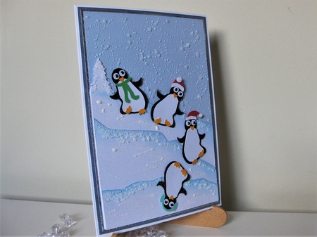 Tumbling penguins card topper by Pat Mottram