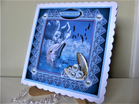 dolphin and pearls by Pat Mottram