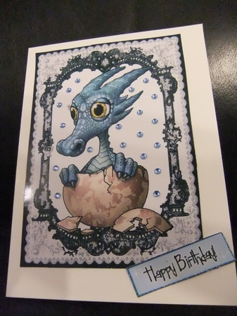 Little Blue Dragon in Black Lace Frame by Paula Savage