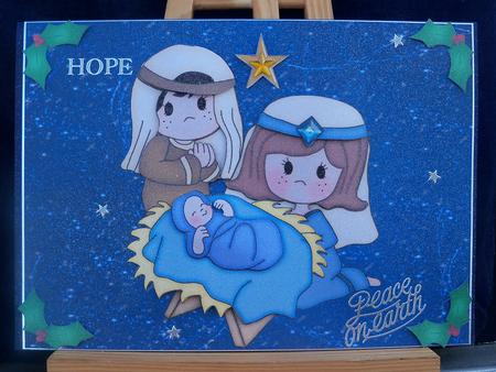 Mary, Joseph & Baby Jesus on Blue Sparkle Paper by Pauline Worthington