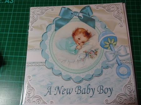 Sweet baby boy with blue bow & rattle on lace/fur 8x8 by Penni Currie