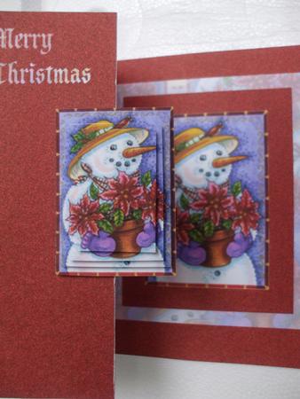 Snowman and Ponsieta Plant by Priscilla Sharp