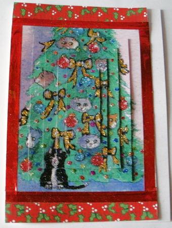 Cats Hiding Out in the Christmas Tree Pyramid by Redonda Haddock